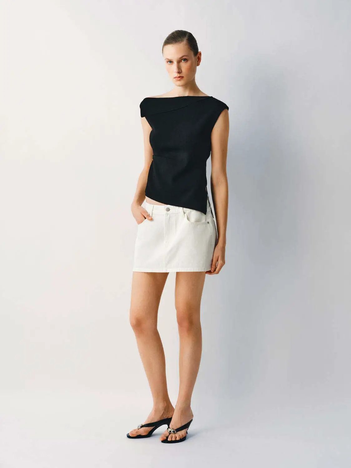 Medium Stretch T-Shirt, black knitted top with draped neckline worn with white mini skirt