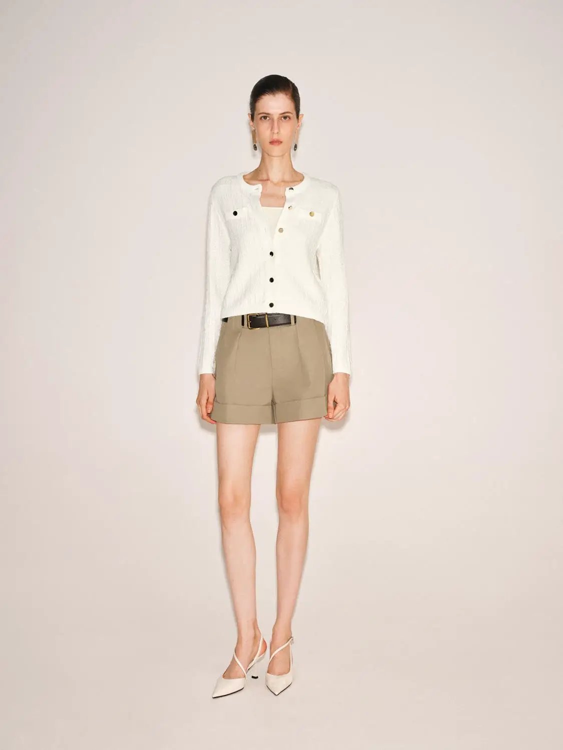 Knitted cardigan, white by Urban Revivo Fashion, front-button style with black and gold buttons.