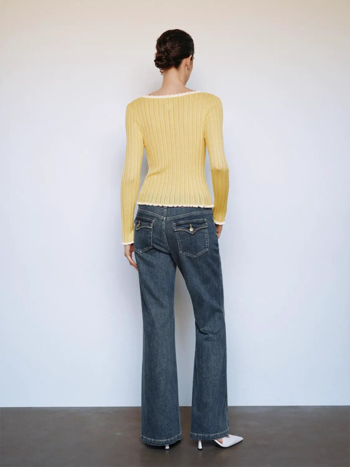 Ribbed square-neck bow long-sleeve knit T-shirt in yellow with raw hem, back view
