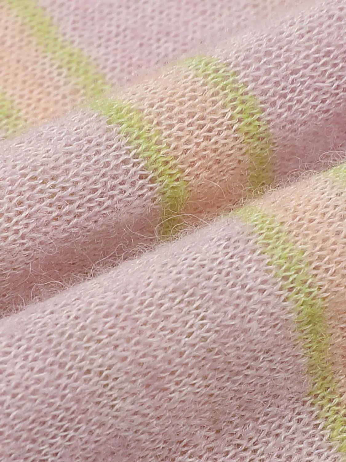 Knit T-shirt fabric in soft pink with neon lime stripe detailing; close-up knit texture.