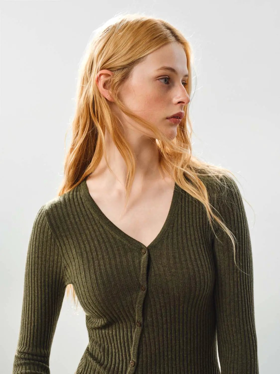 Fitted ribbed knit V-neck cardigan in olive green, long sleeves, button-front