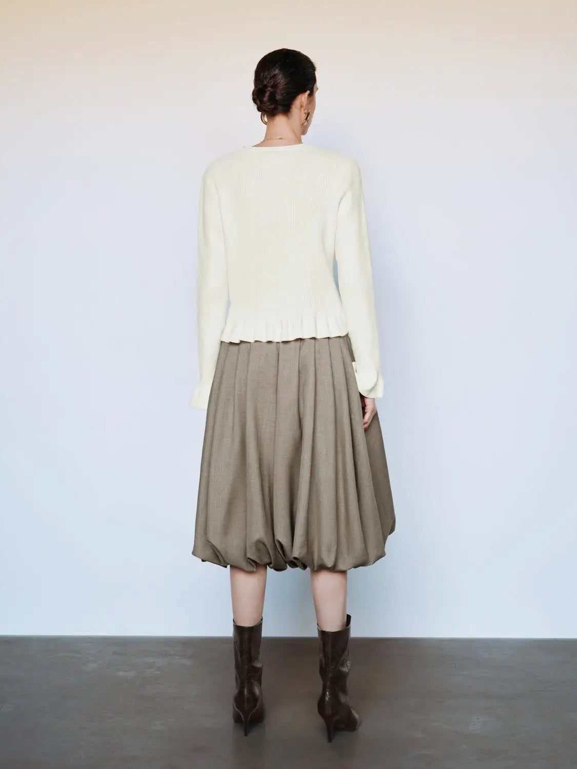 Ribbed heart-button cardigan in ivory knit with crew neck and long sleeves.