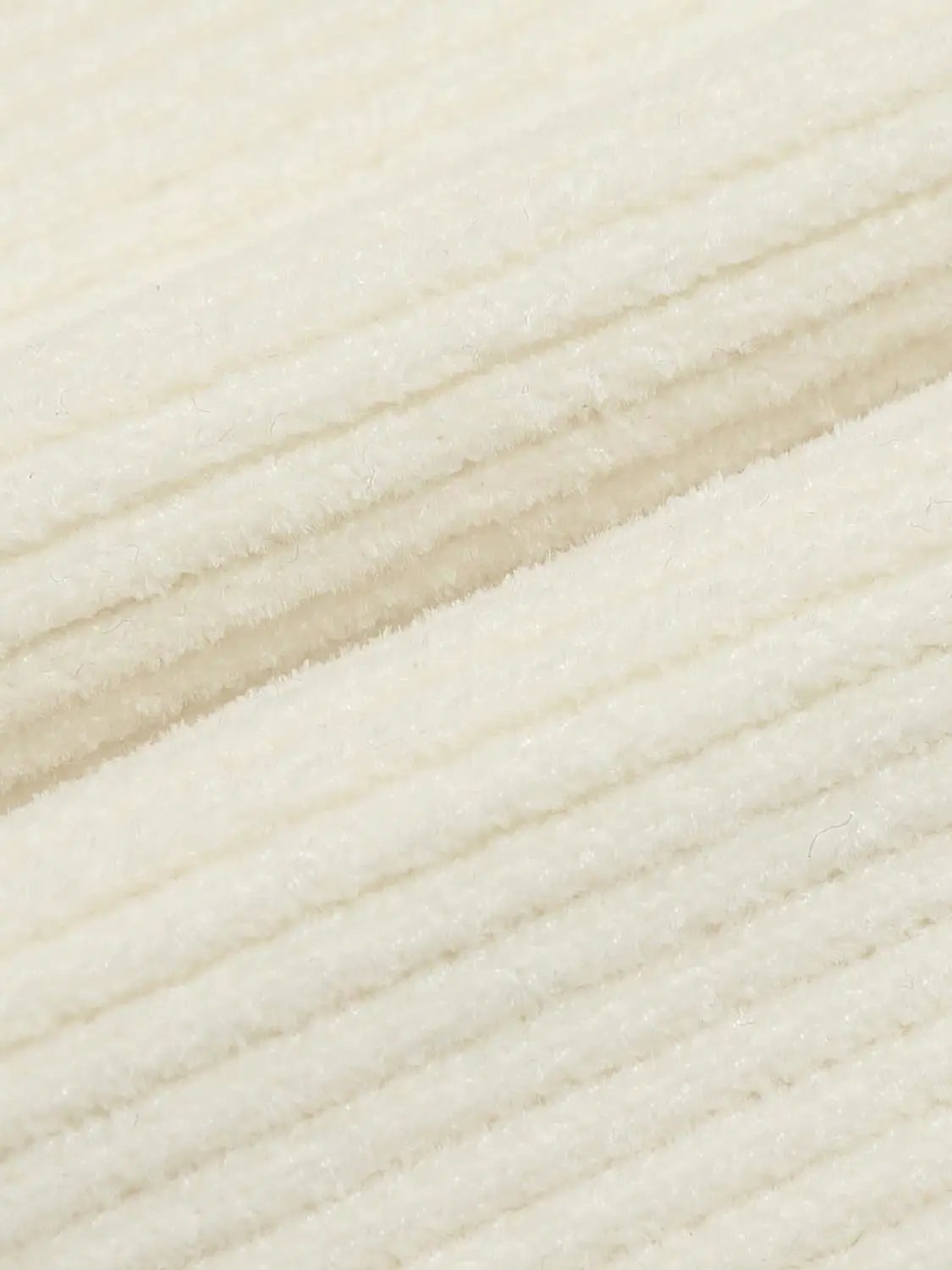 Ribbed heart-button cardigan knit fabric in ivory, close-up texture.