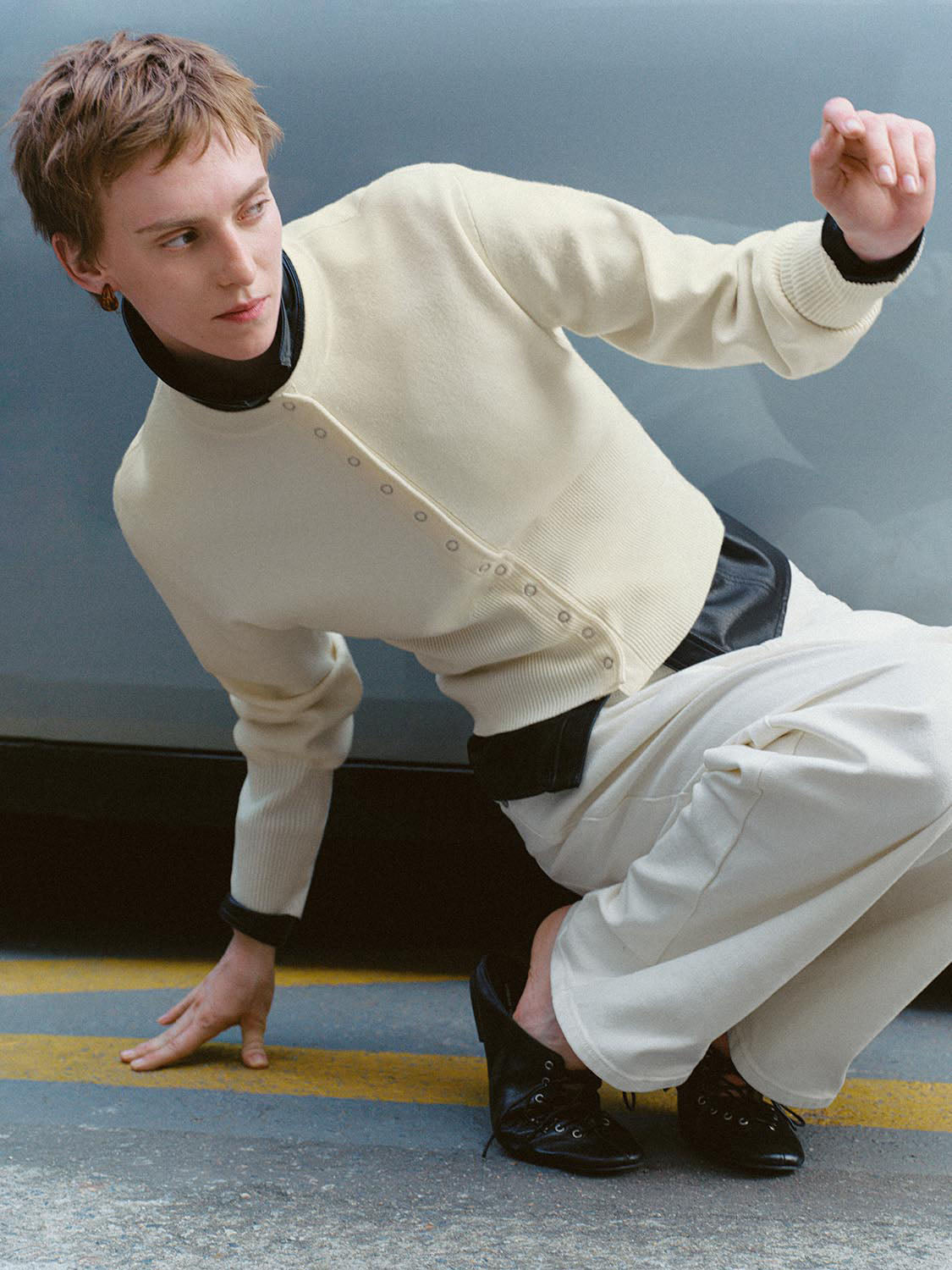 Ribbed button-front cream cardigan with long sleeves worn by model