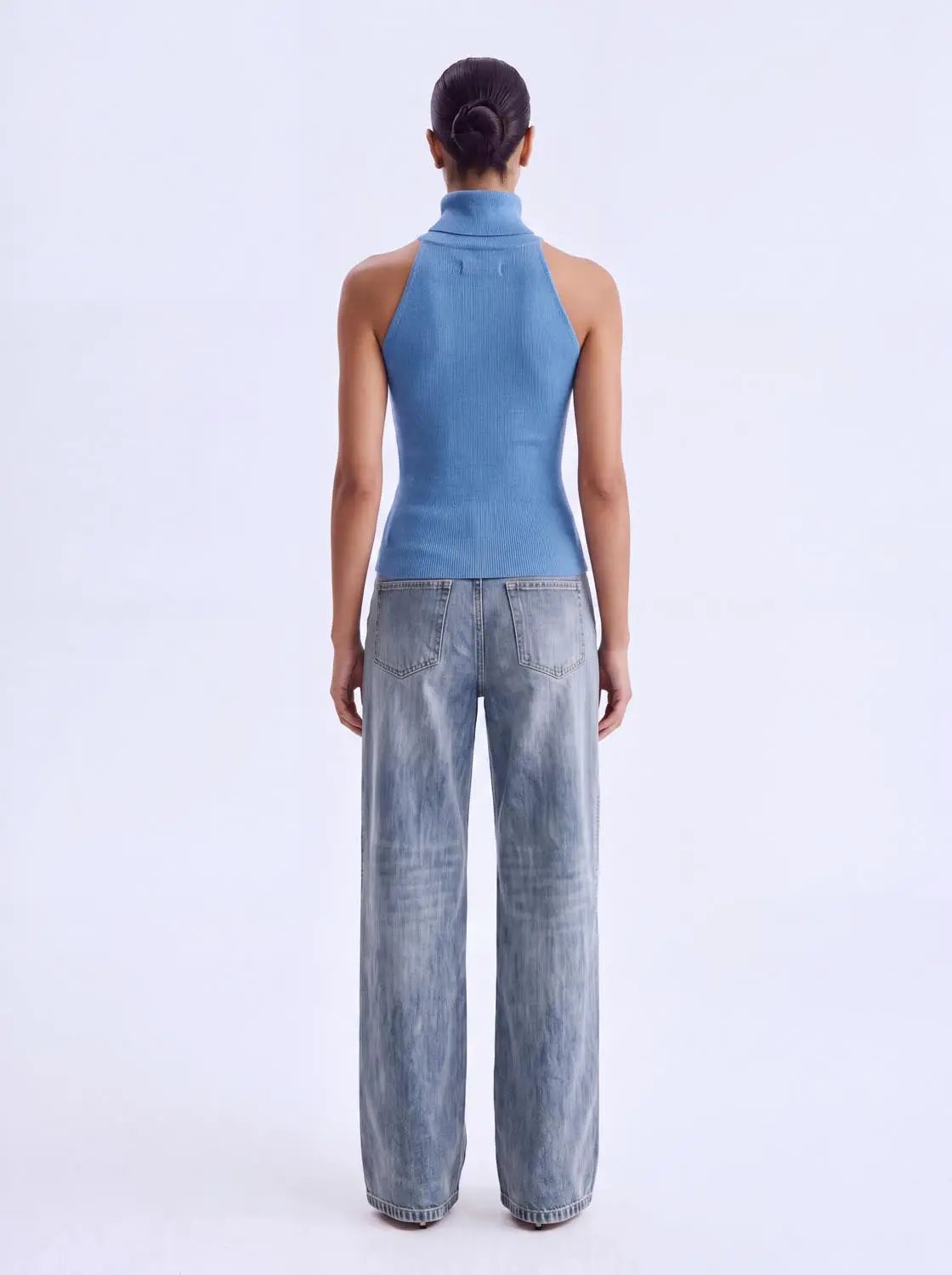 Knit T-Shirt blue sleeveless high-neck top, back view on model