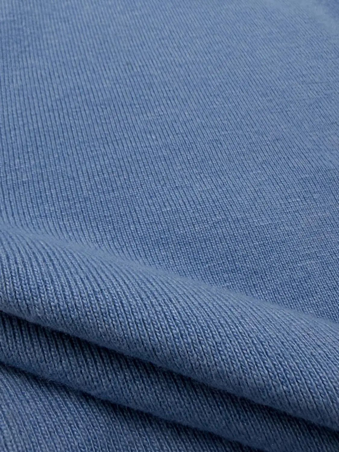 Knit T-Shirt blue rib-knit fabric close-up showing fine textured pattern