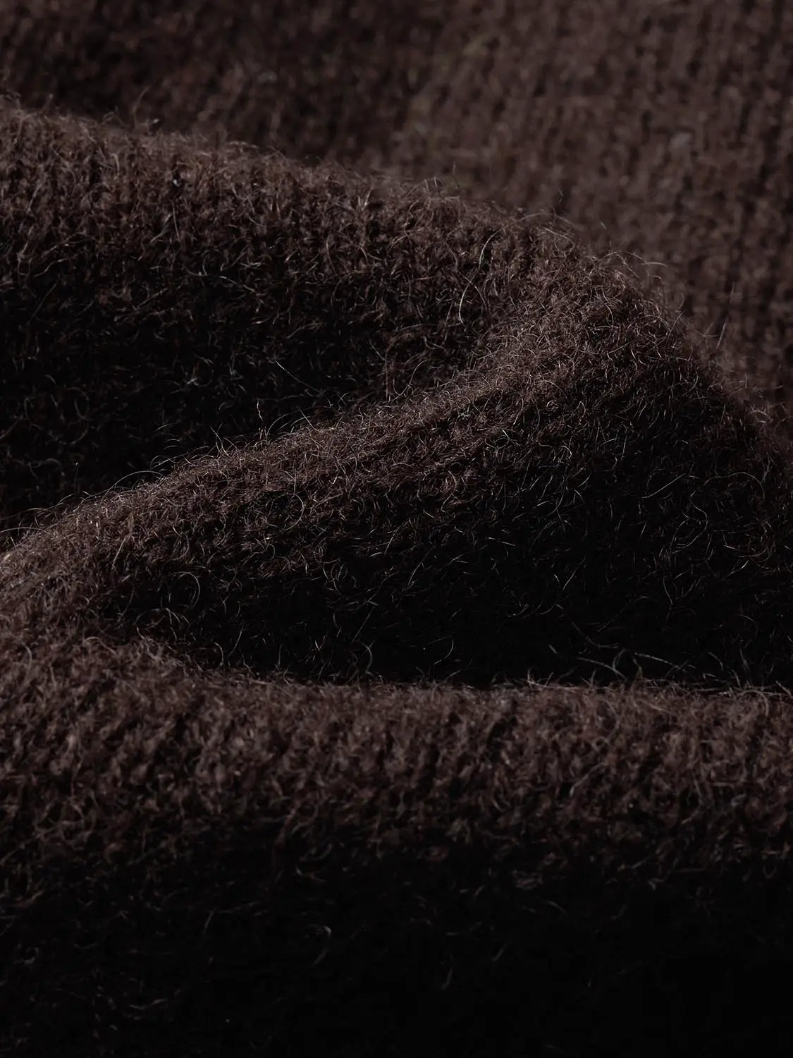Knit Jacket fabric close-up in dark brown, fuzzy knit texture.