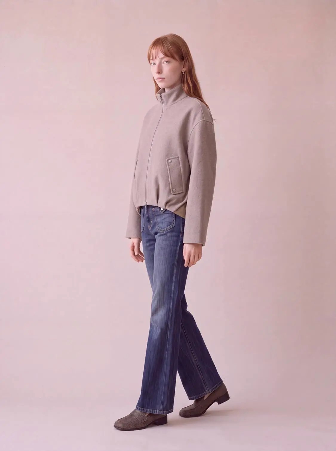 Funnel-Neck Thick Jacket in beige with zip front and large patch pocket, worn with jeans
