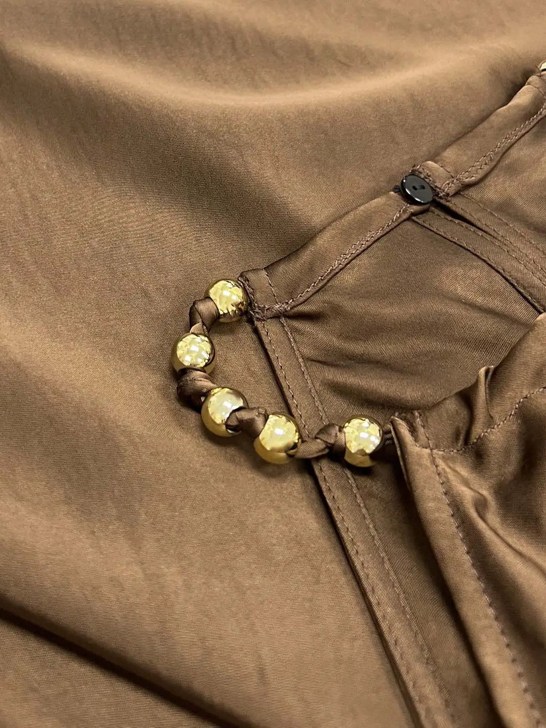 A-Line dress in brown satin with gold-tone bead belt embellishment at the waist