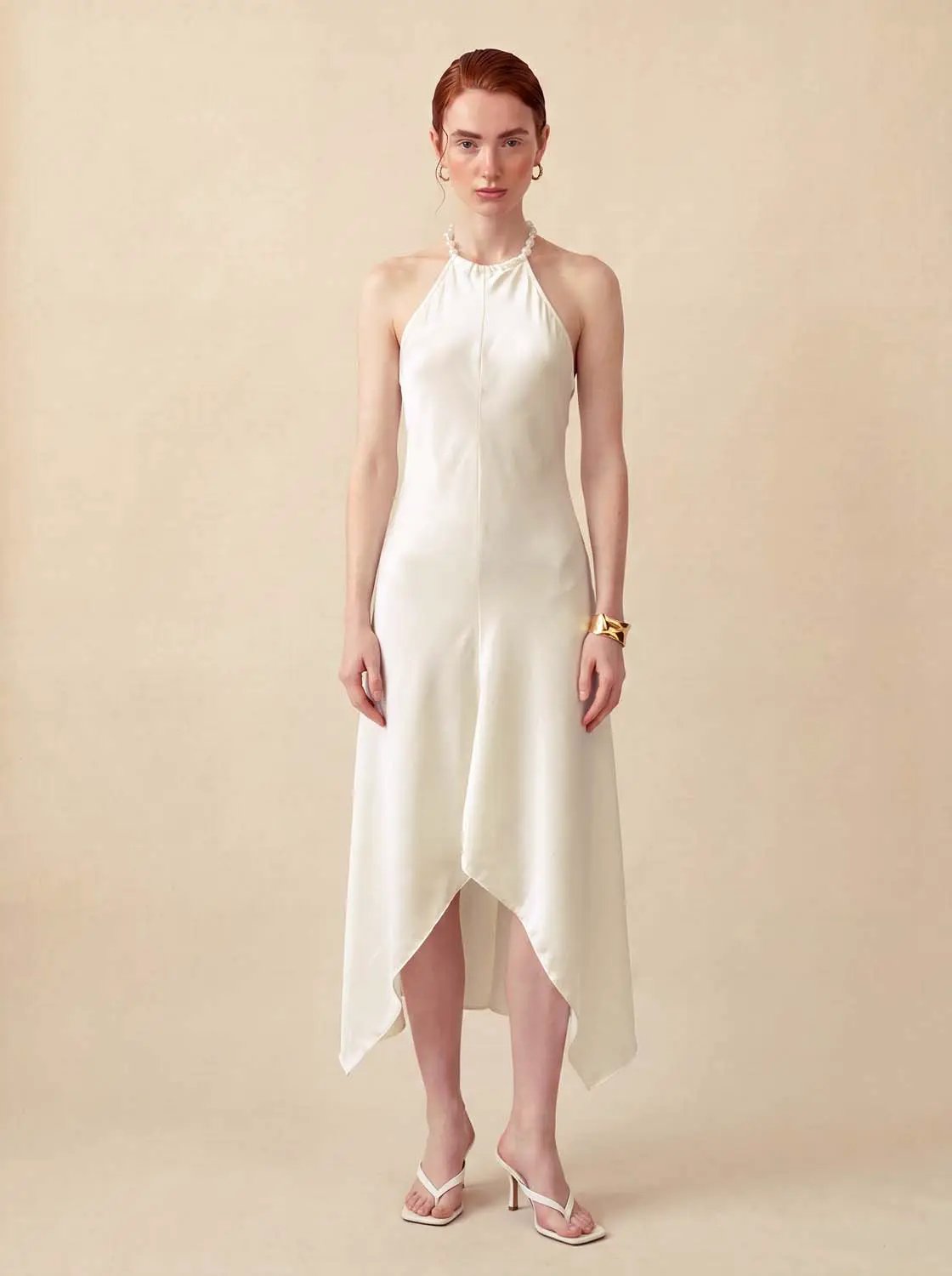 A-Line Dress in white satin with halter-neck and asymmetric hem