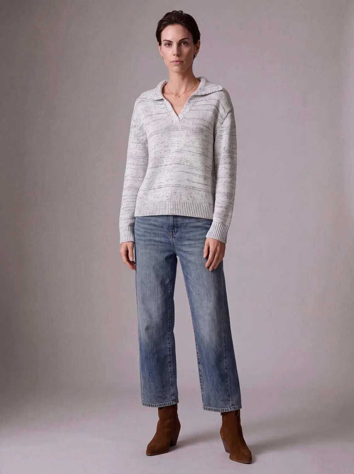 Long Sleeve Polo Knitted T-Shirts in light gray knit, worn with blue jeans.