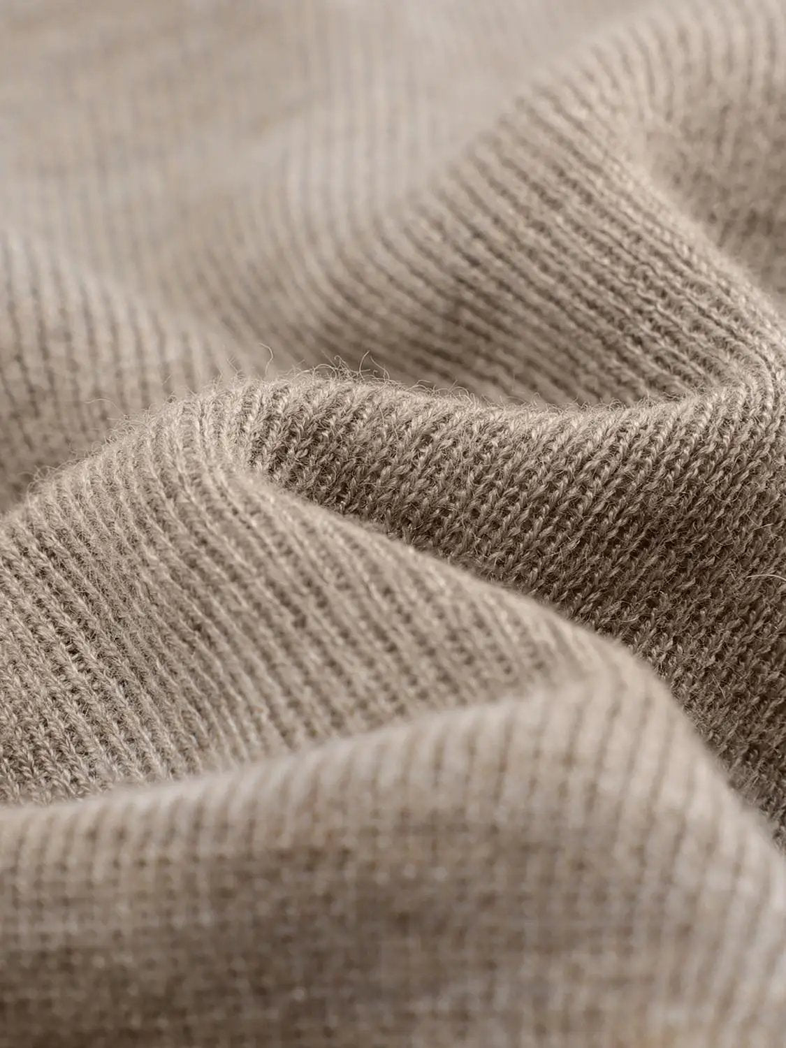 Sleeveless wrap-front knit top with collar in beige textured knit fabric
