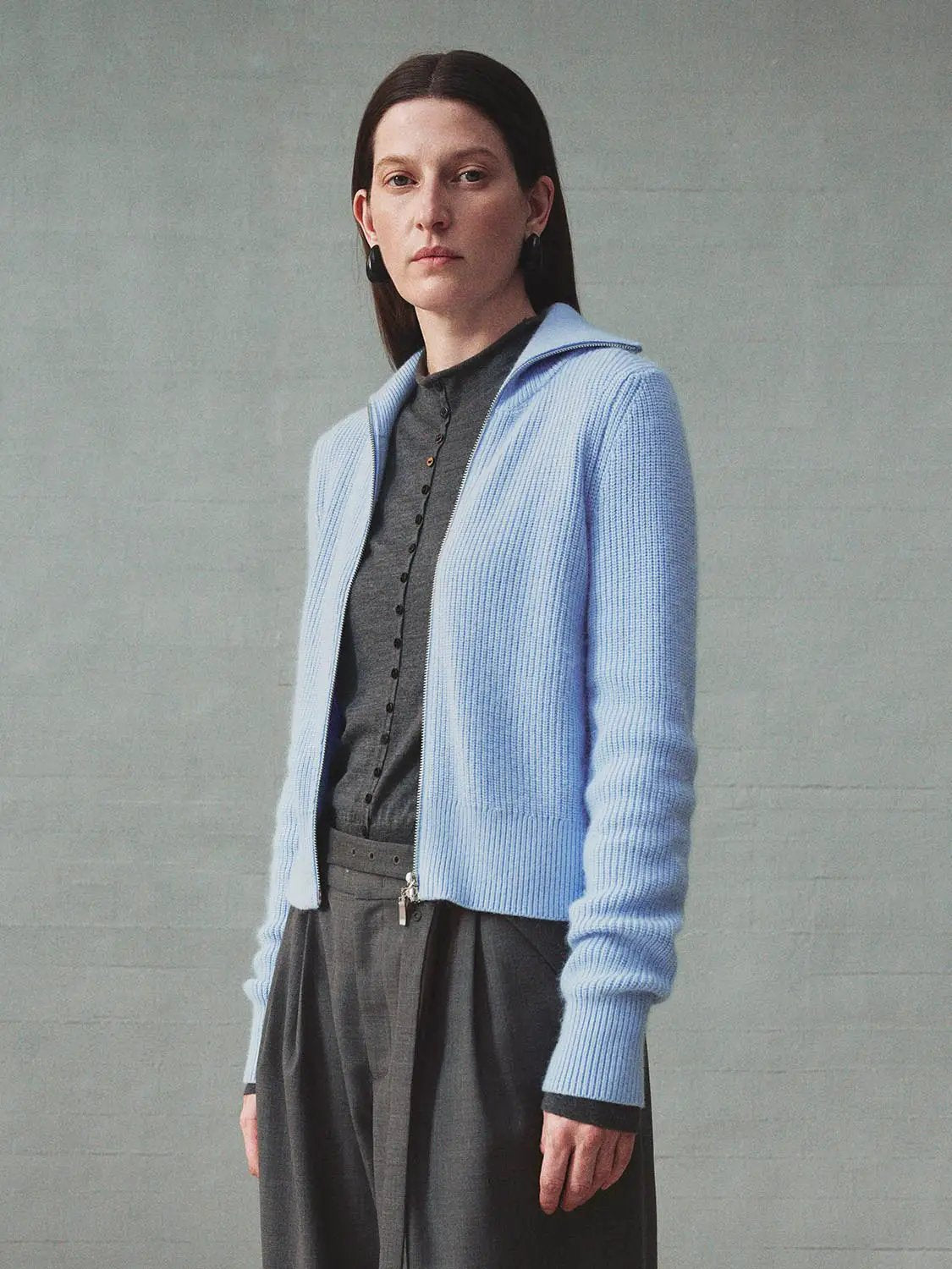 Knit Jacket in light blue knitted cardigan with zip front, ribbed cuffs.