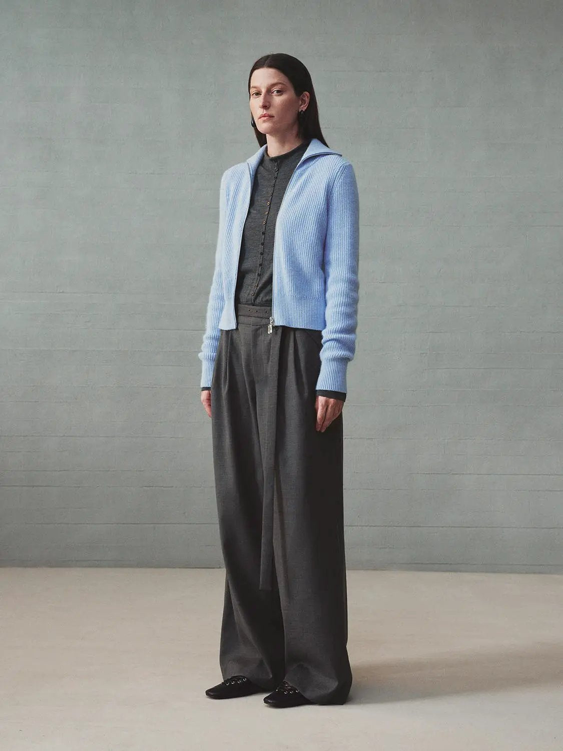 Knit jacket by Urban Revivo Fashion in light blue, styled with a dark top and gray wide-leg trousers.