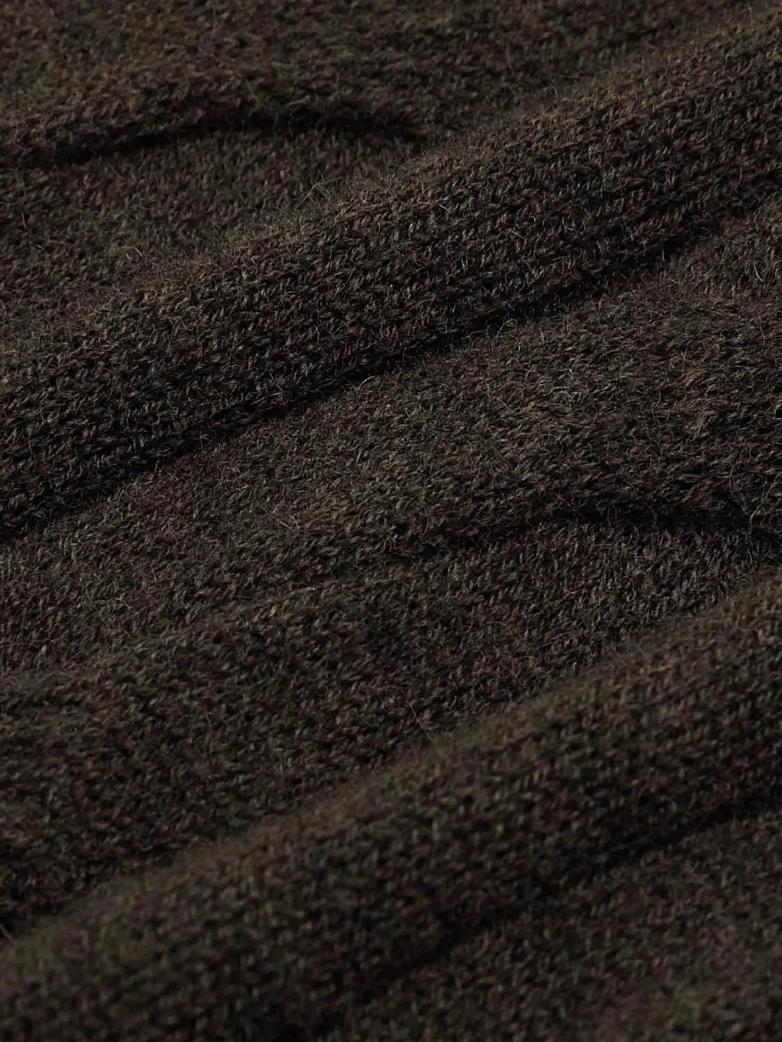 Knitted T-Shirts fabric in dark brown with a close-up knit texture