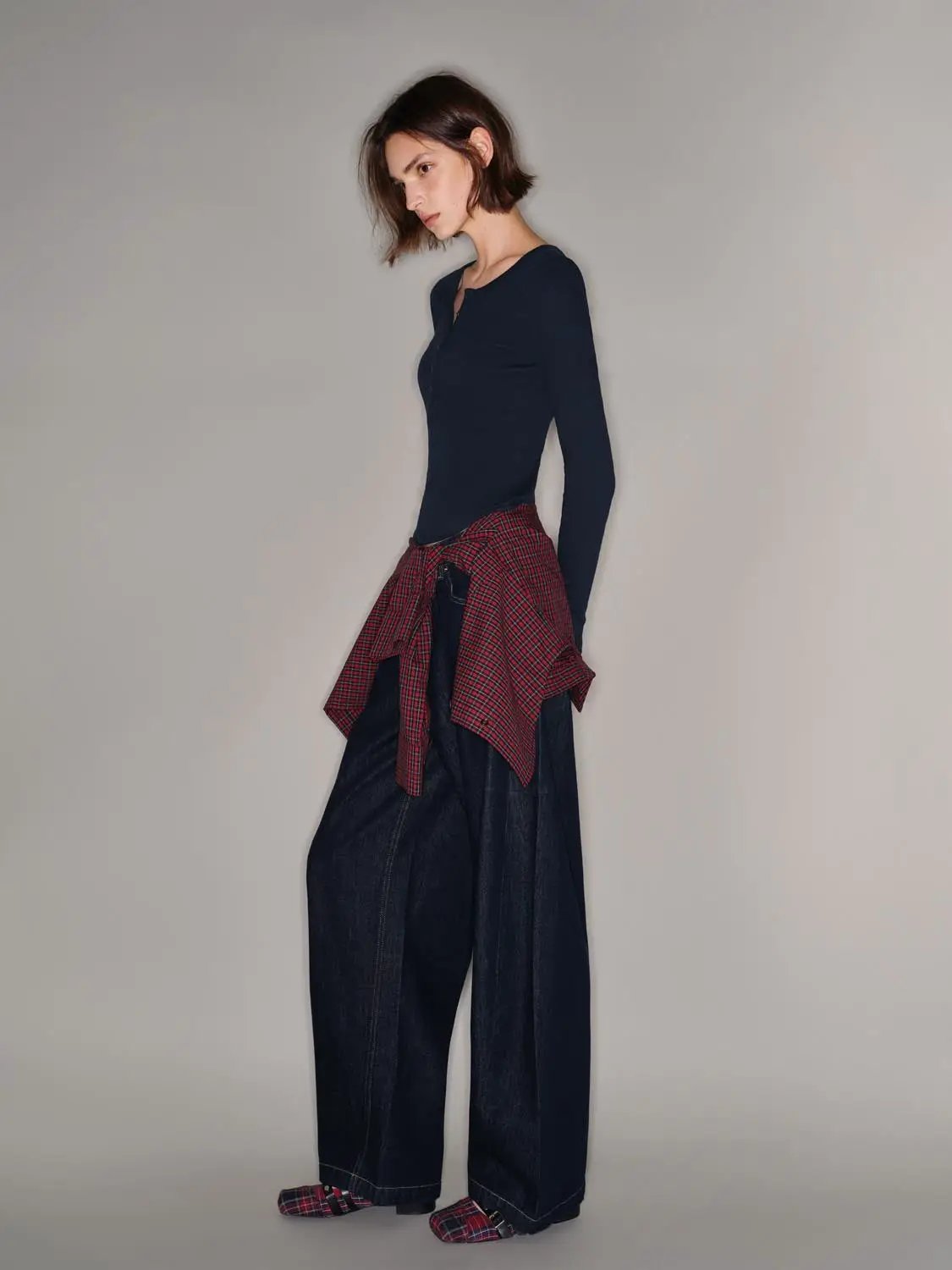 T-Shirt by Urban Revivo Fashion, navy long-sleeve top with red plaid shirt tied at the waist over wide-leg denim pants