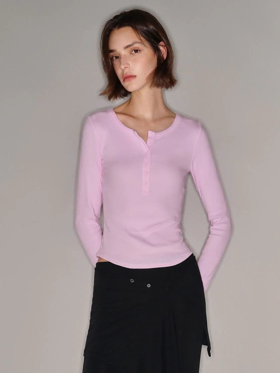 Pink long-sleeve henley T-shirt with button placket