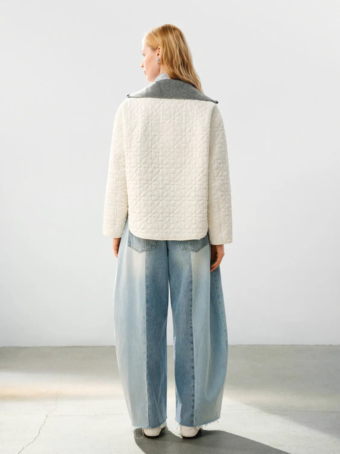 Padded Jacket in cream with quilted pattern and gray collar; back view paired with light-wash wide-leg jeans.