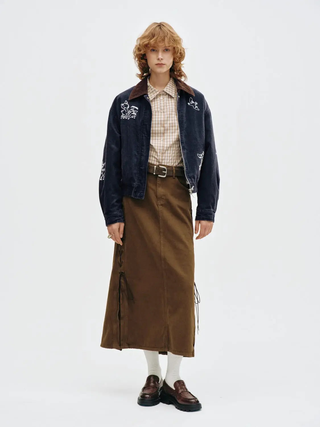 Padded Jacket in navy with brown corduroy collar and white embroidery accents.