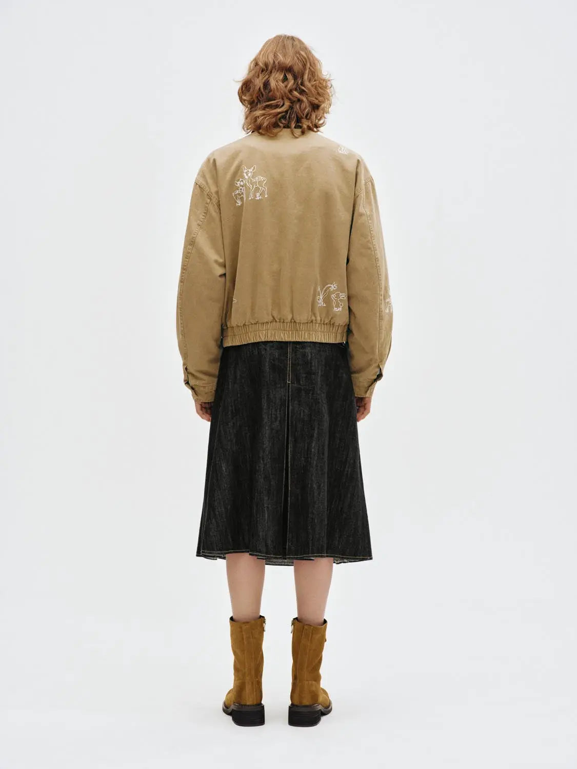 Padded Jacket tan with white embroidery; back view, elastic hem