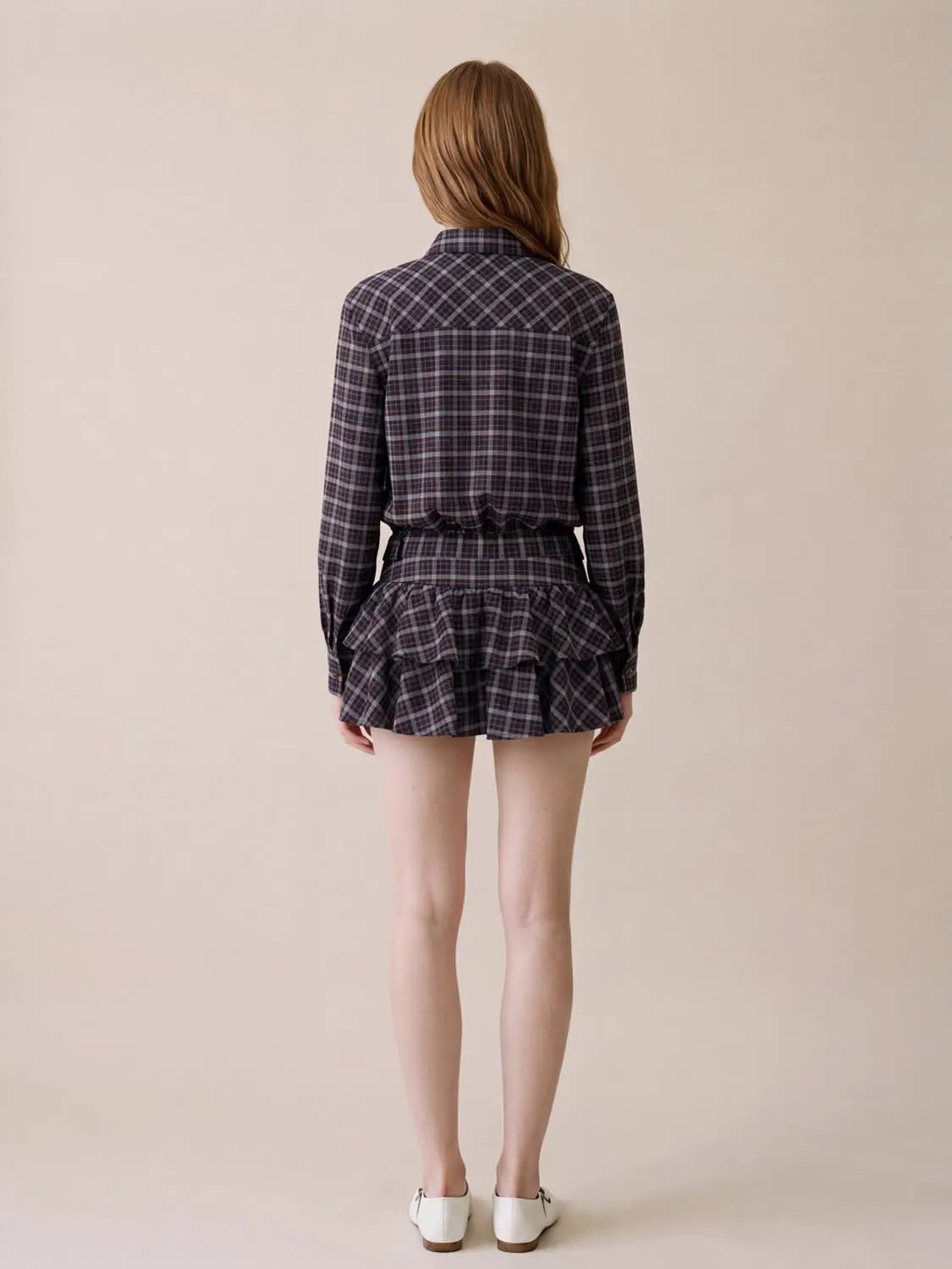 Shirt-collar long-sleeve plaid skater dress with tie waist and layered ruffle hem, back view