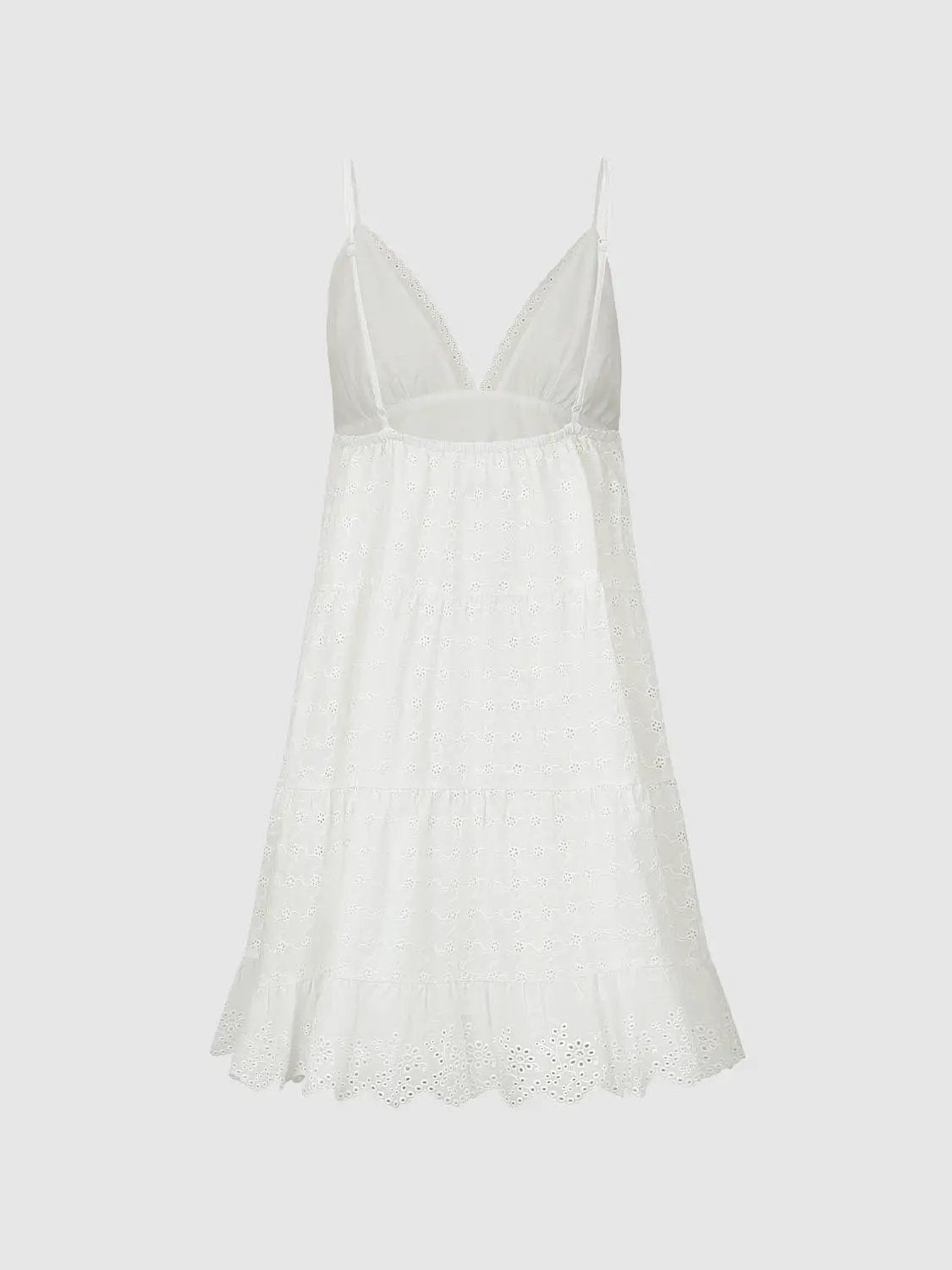 A-Line white dress with spaghetti straps, V-neck lace trim, and eyelet scalloped hem