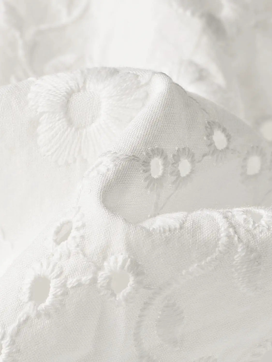 A-Line dress in white eyelet cotton fabric.