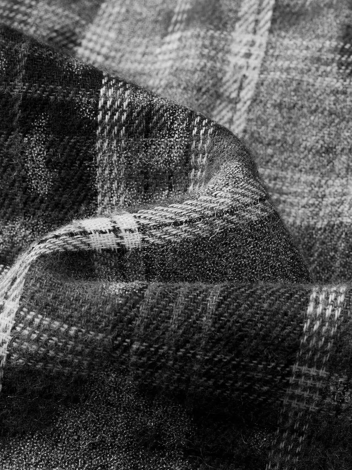 A-Line dress fabric close-up in dark plaid tweed texture