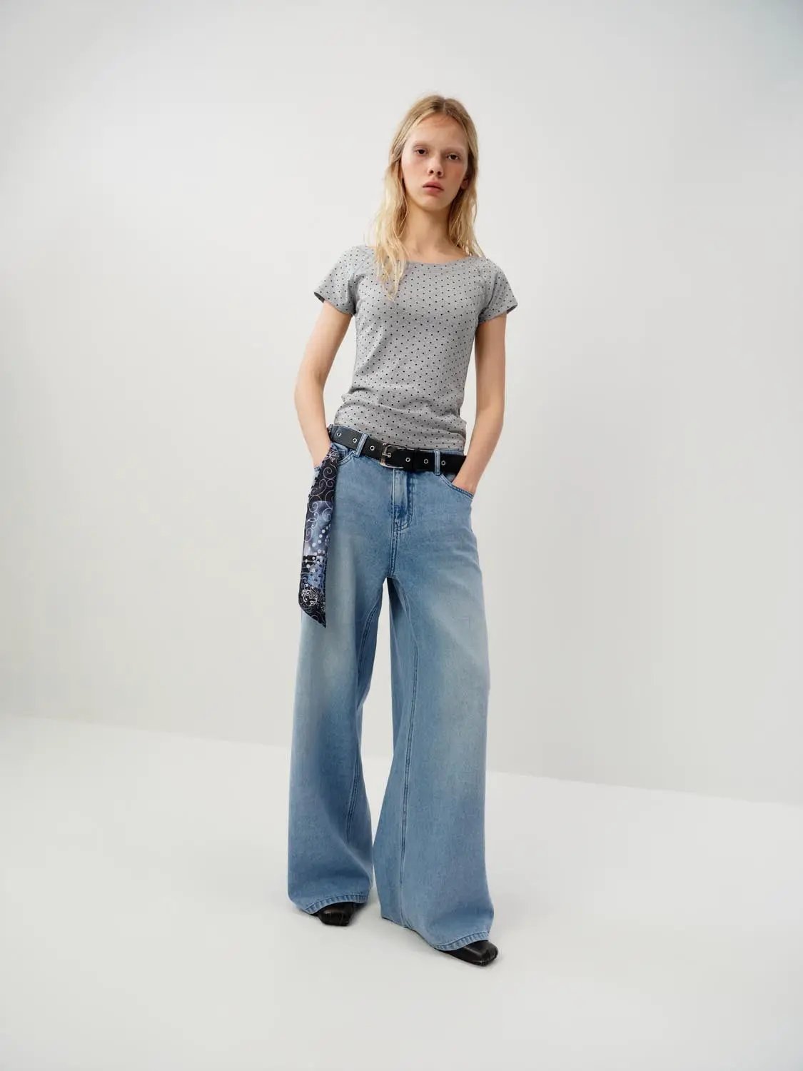 Wide-leg cotton jeans in light blue with decorative patch detail.