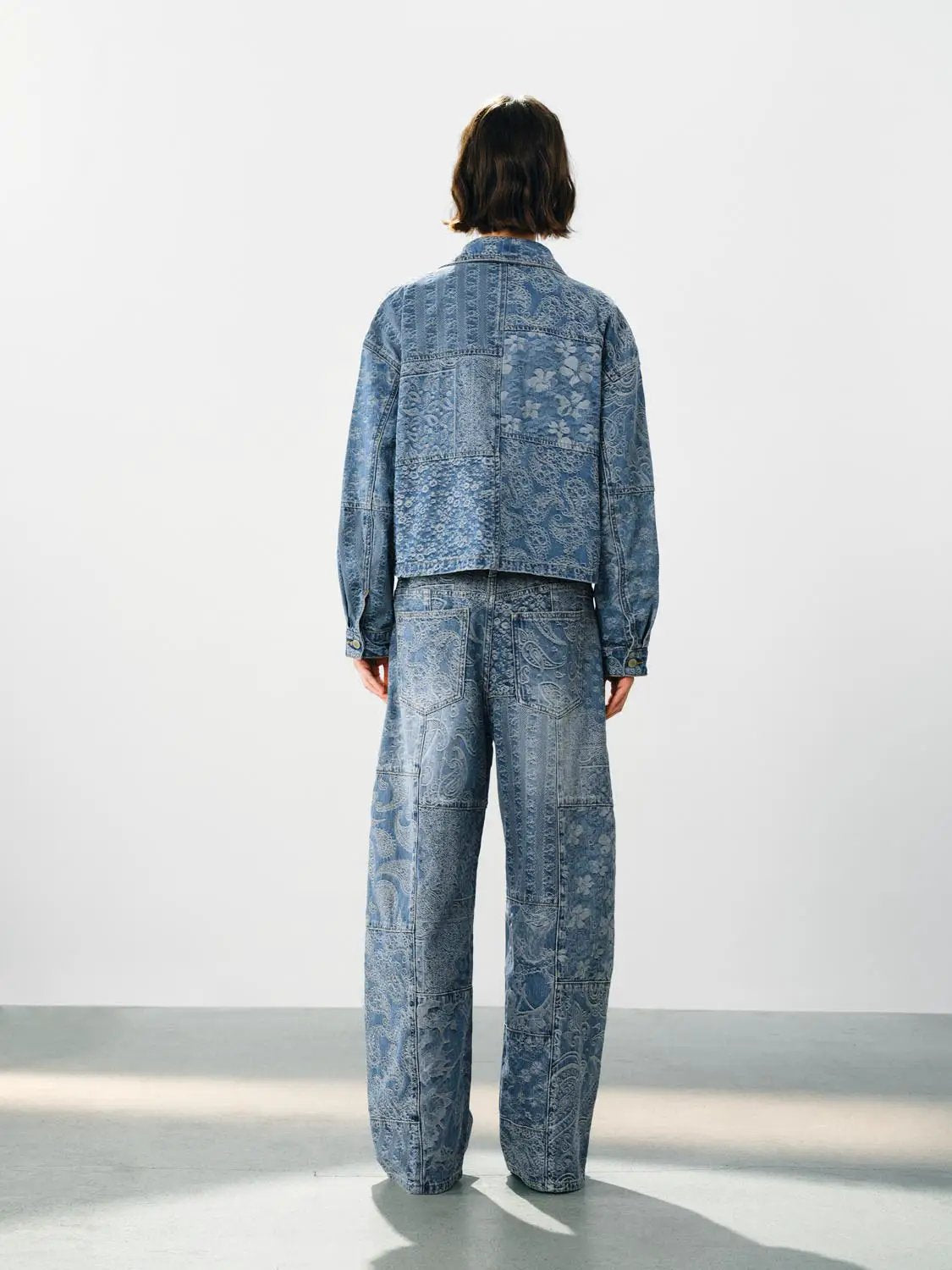 Jeans by Urban Revivo Fashion in blue patchwork denim with floral paisley print (back view)