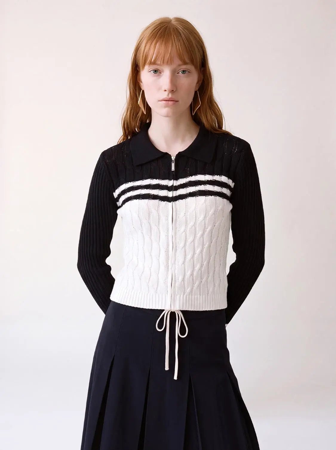 Striped collared knitted cardigan by Urban Revivo Fashion, black sleeves and white body, zip front