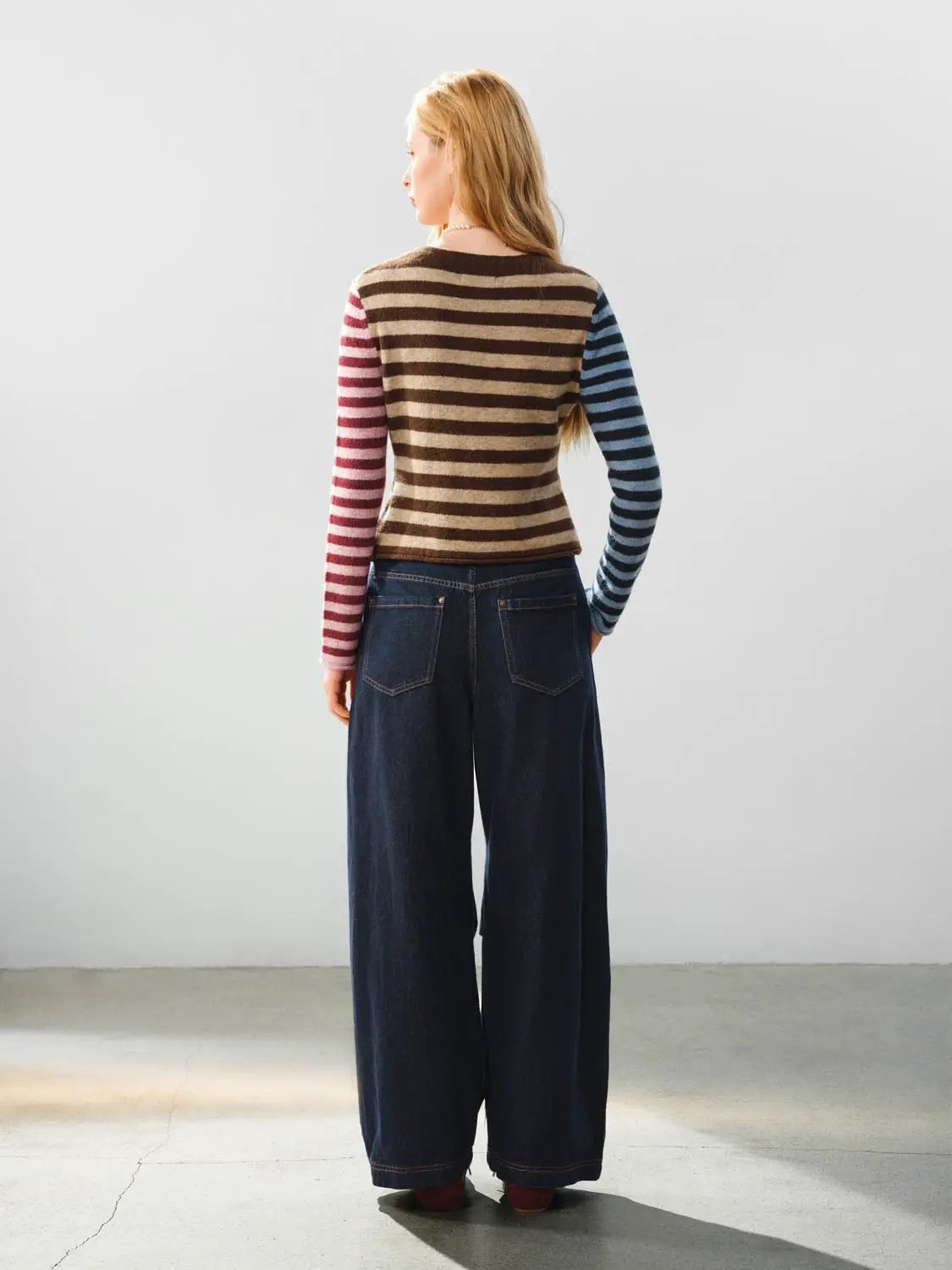 Embroidered striped knit cardigan, crew neck; color-block body with brown/beige stripes and red/blue sleeves