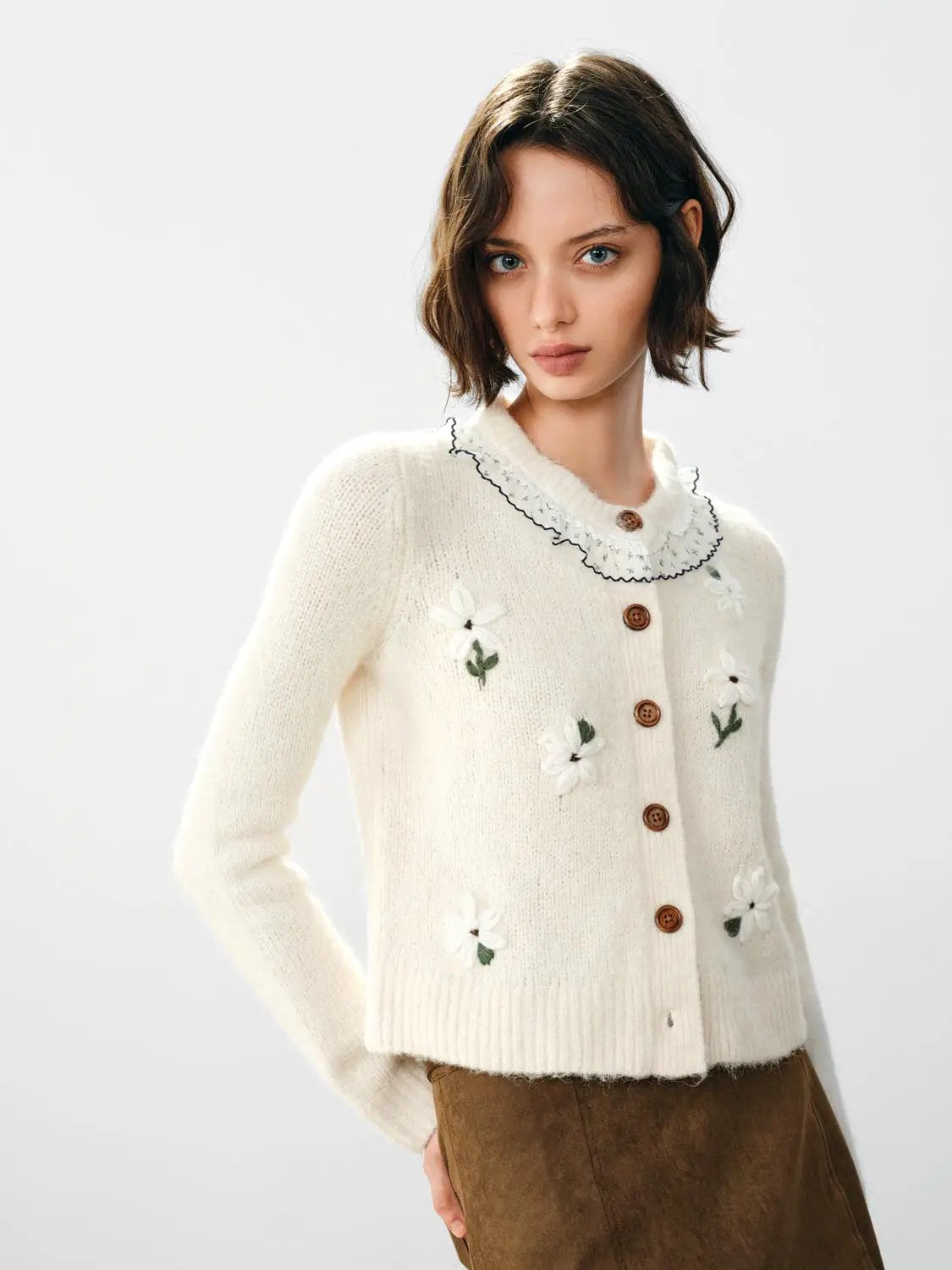Floral embroidered ruffle collar long sleeve cardigan in cream knit with brown buttons