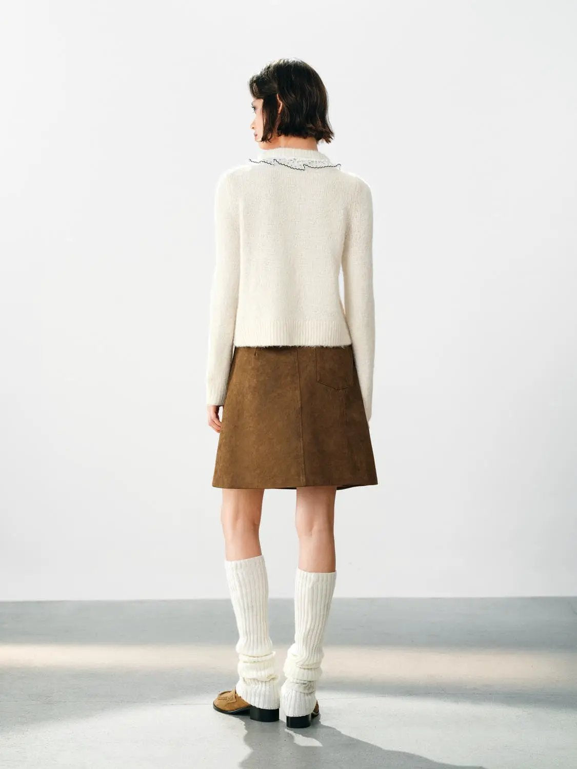 Floral-embroidered ruffle-collar knit cardigan in cream with long sleeves