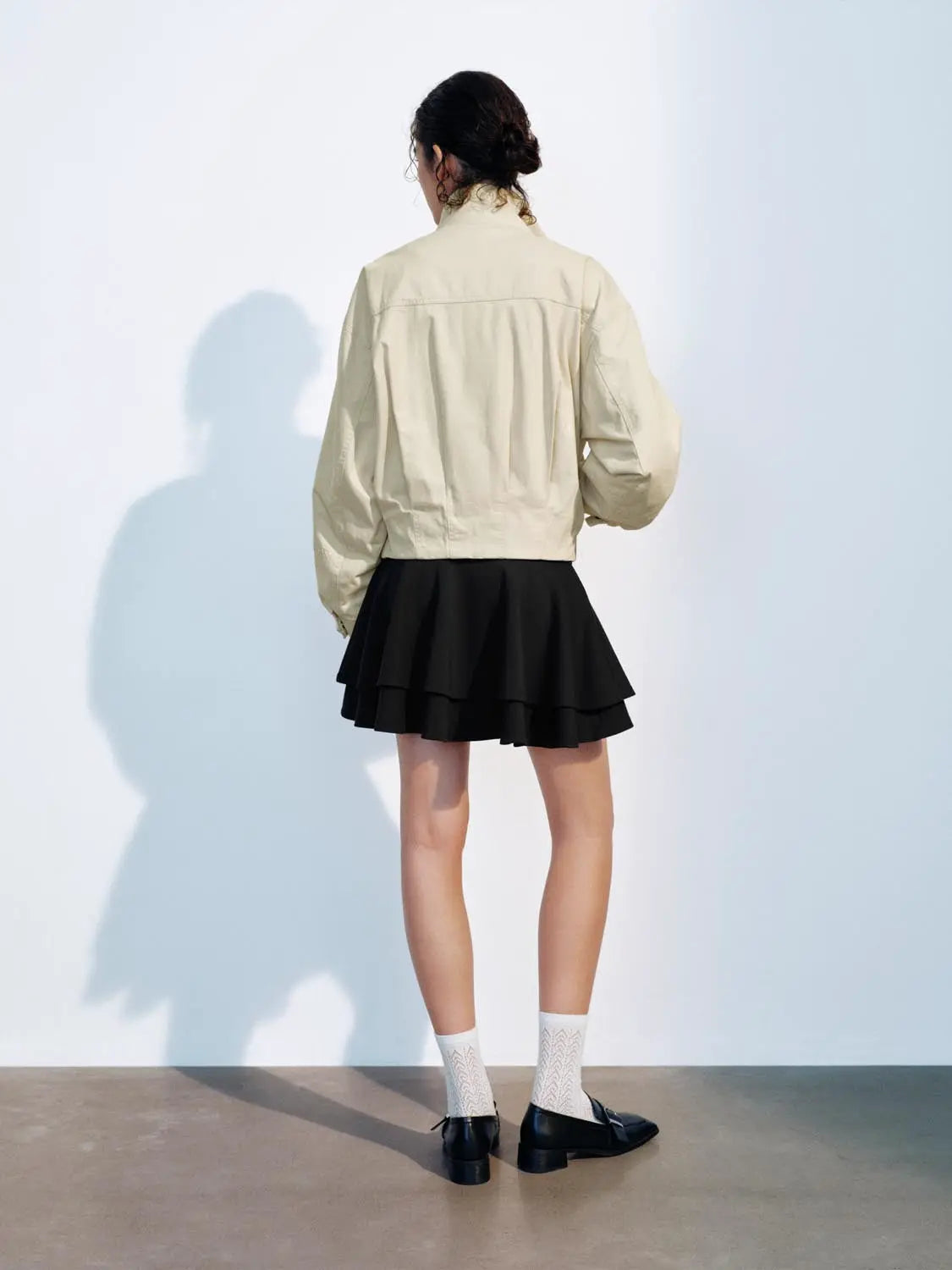 Padded Jacket beige by Urban Revivo Fashion; back view of model wearing a black layered mini skirt