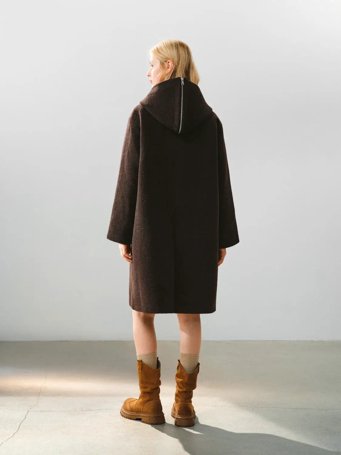 Coat with hood in dark brown teddy fleece, back view.