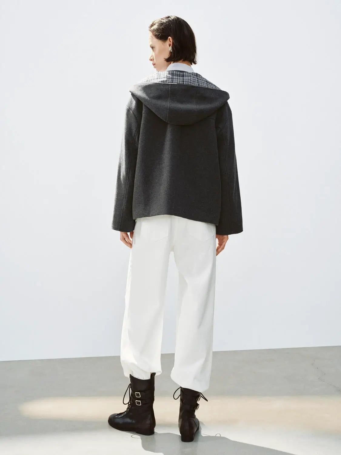 Coat, dark gray hooded style with plaid check collar detail, back view