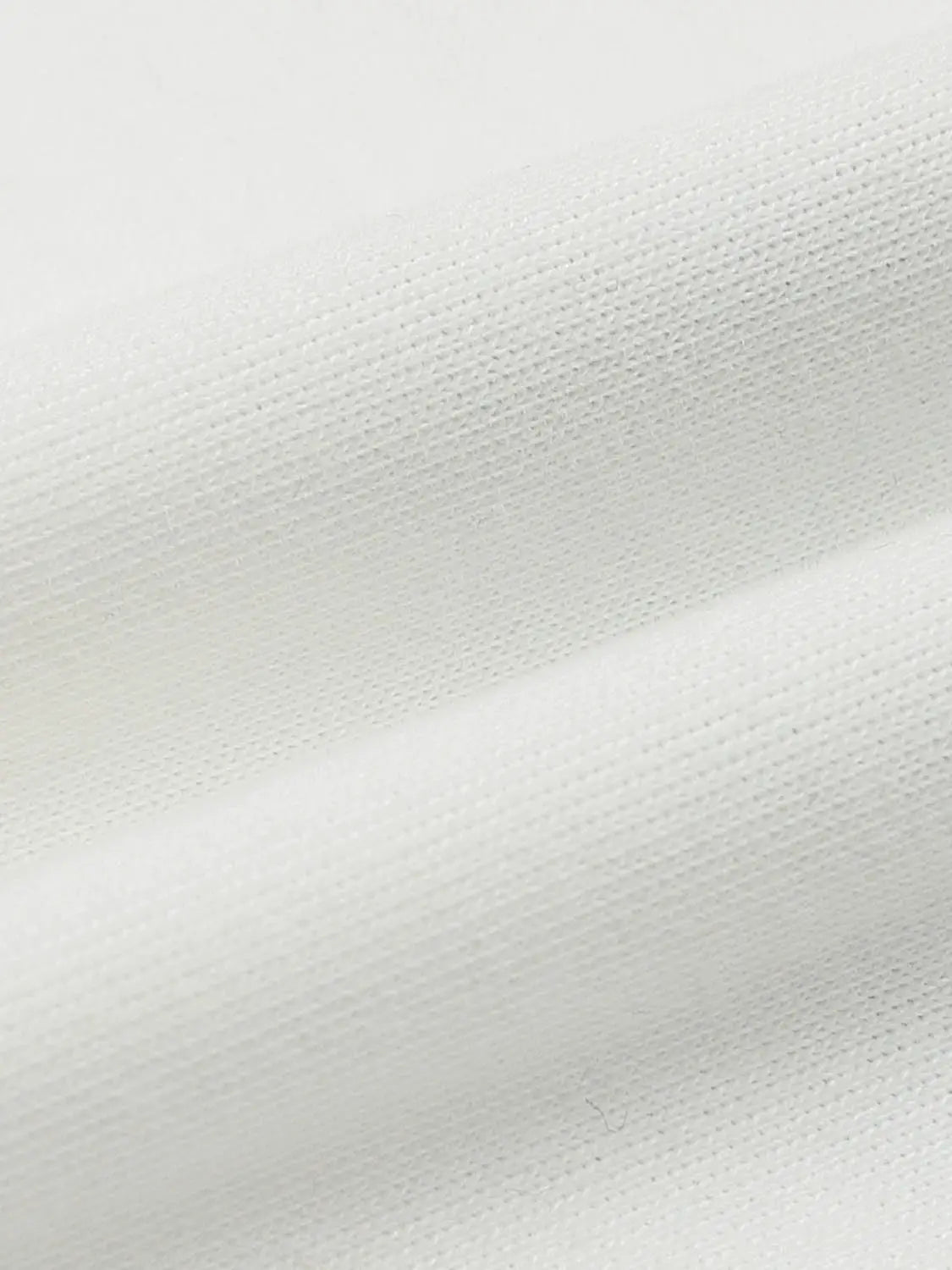 White T-shirt fabric close-up showing knit texture