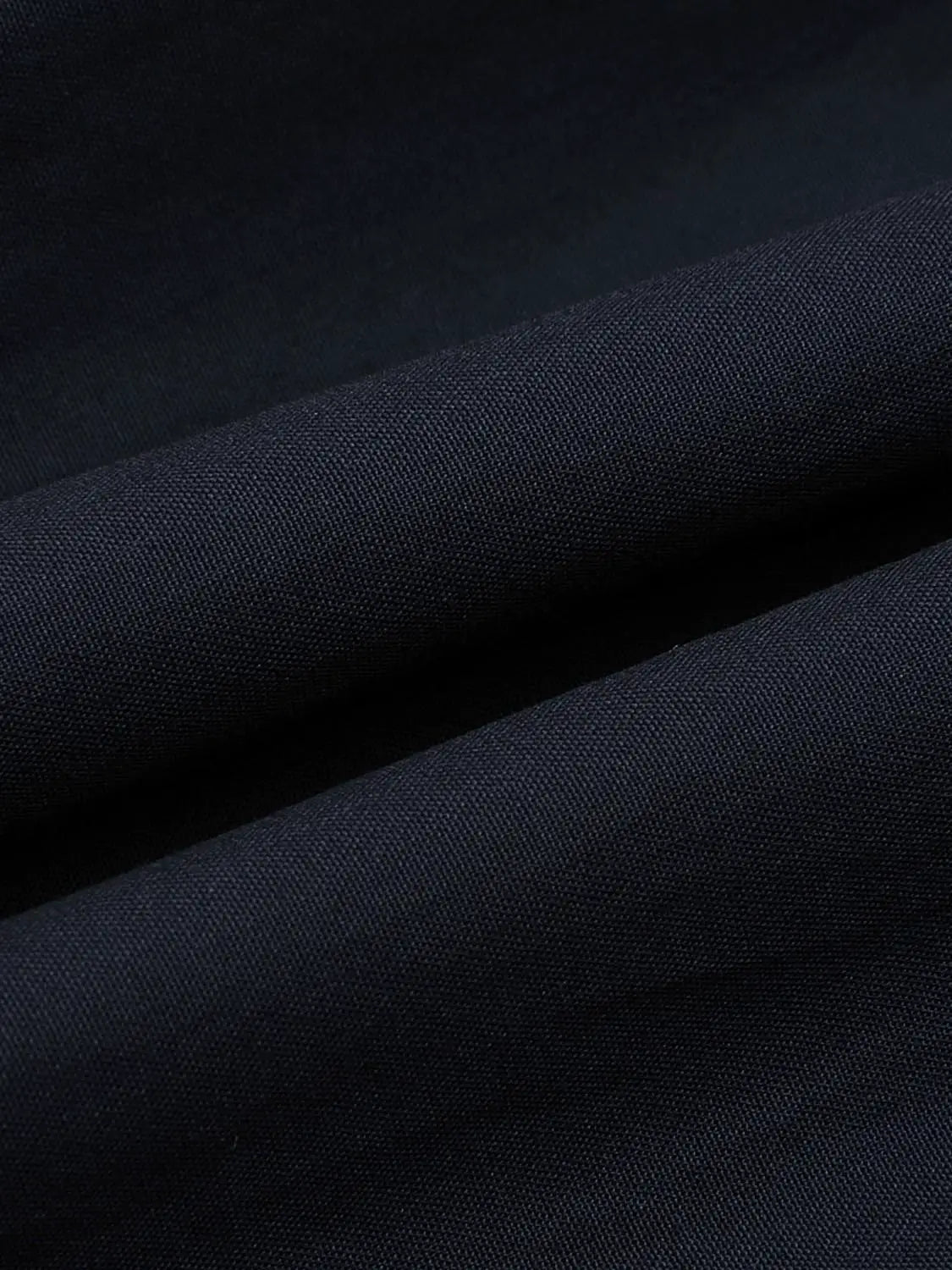 A-Line Skirt fabric in dark navy woven texture with dense weave and matte finish, Urban Revivo Fashion