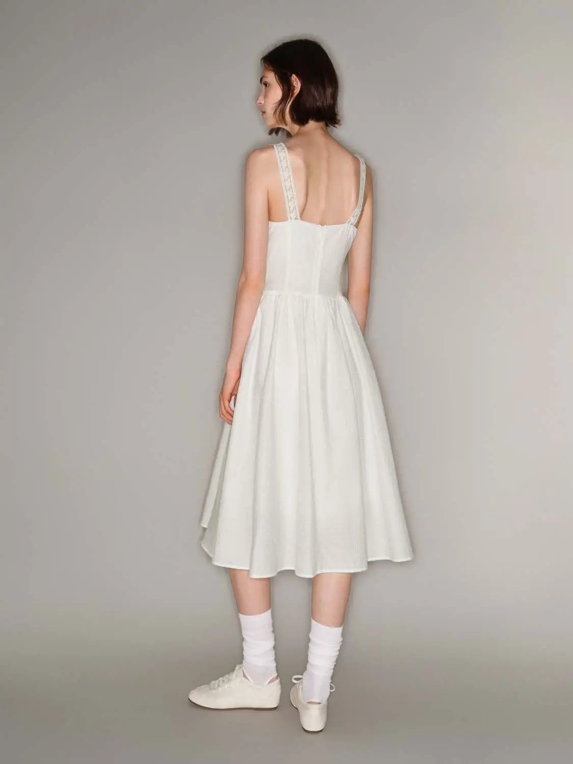 Cotton lace-trim straps front-tie A-line dress in white.