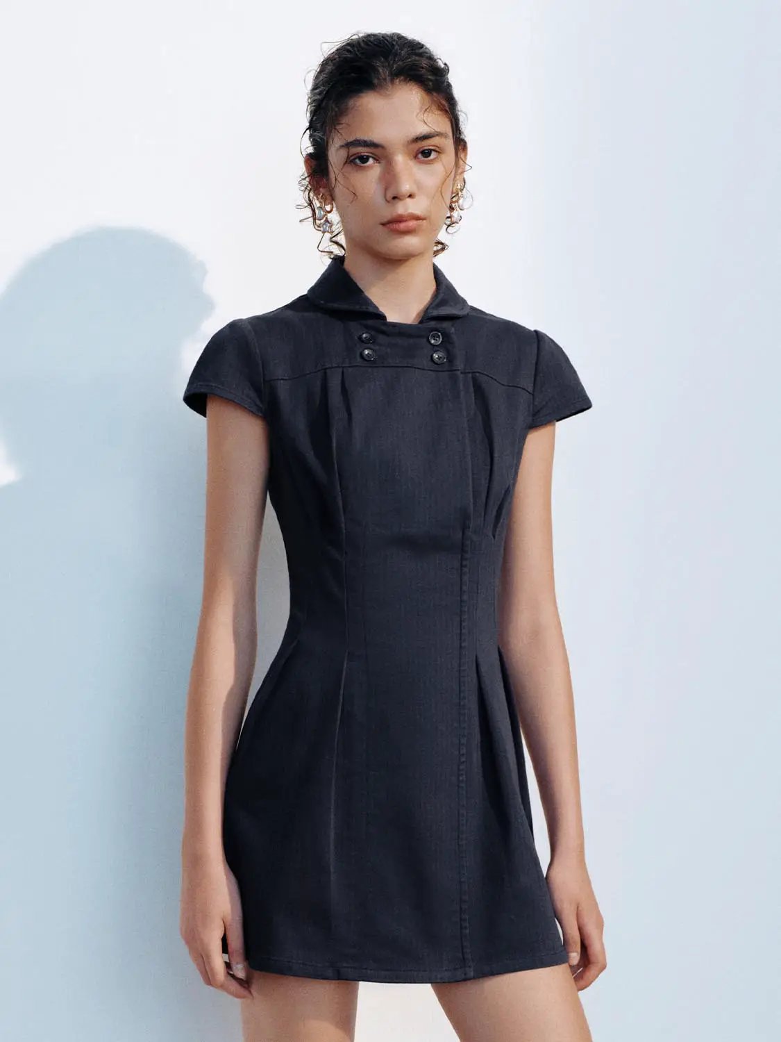A-Line Dress in dark navy fabric with short sleeves and front pleats