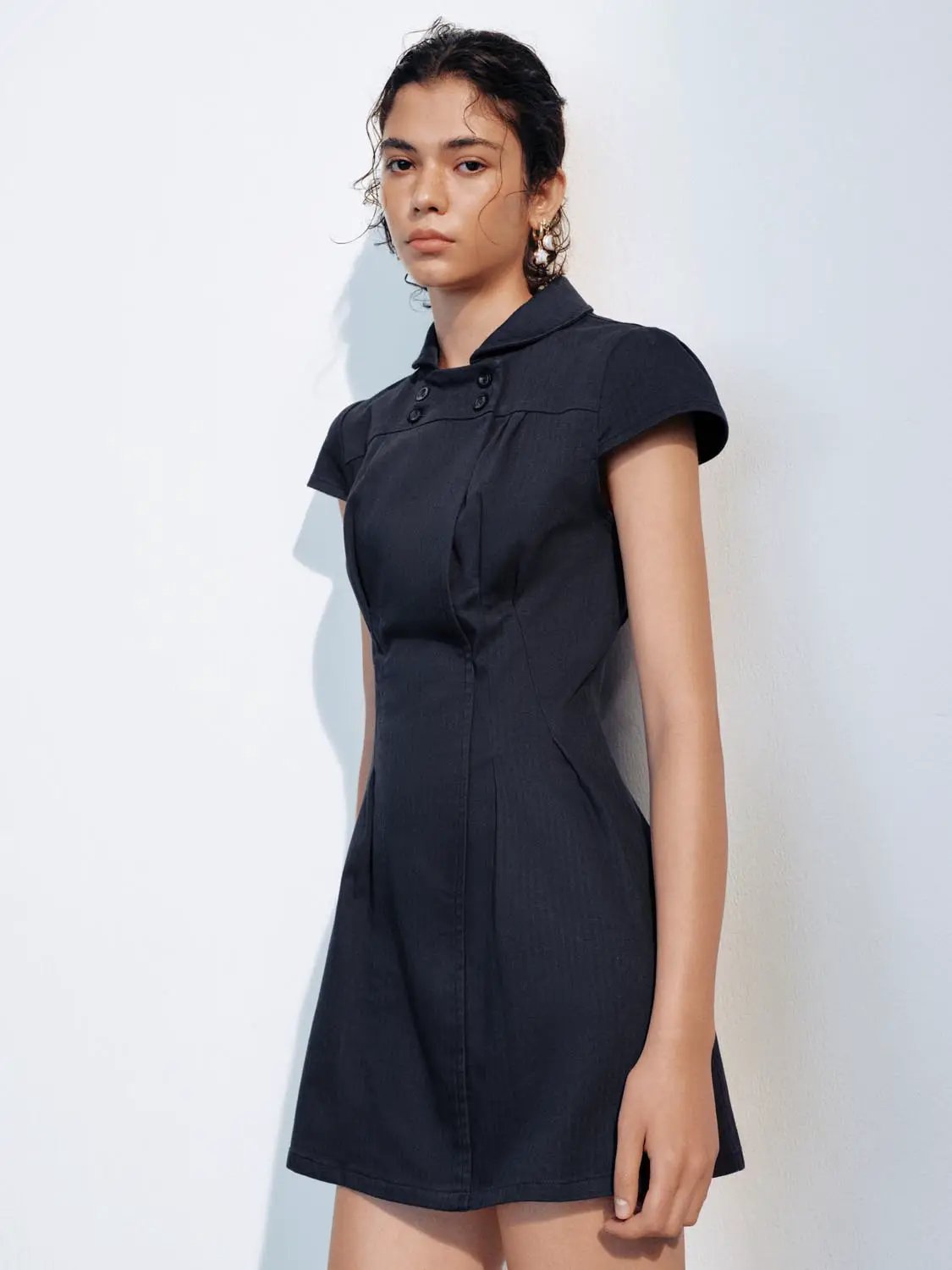 A-Line dress in dark navy with short sleeves and a buttoned high collar.