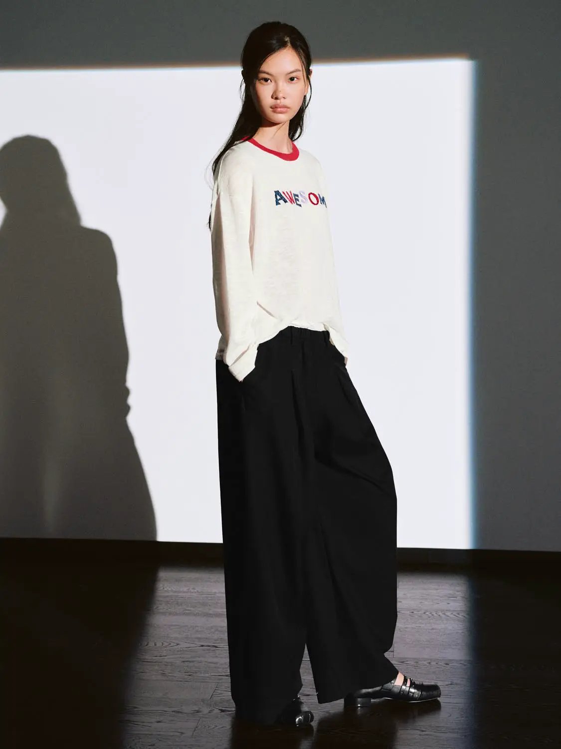 Urban Revivo Knit T-Shirt on model; cream knit with red neckline and multicolor AWESOME lettering