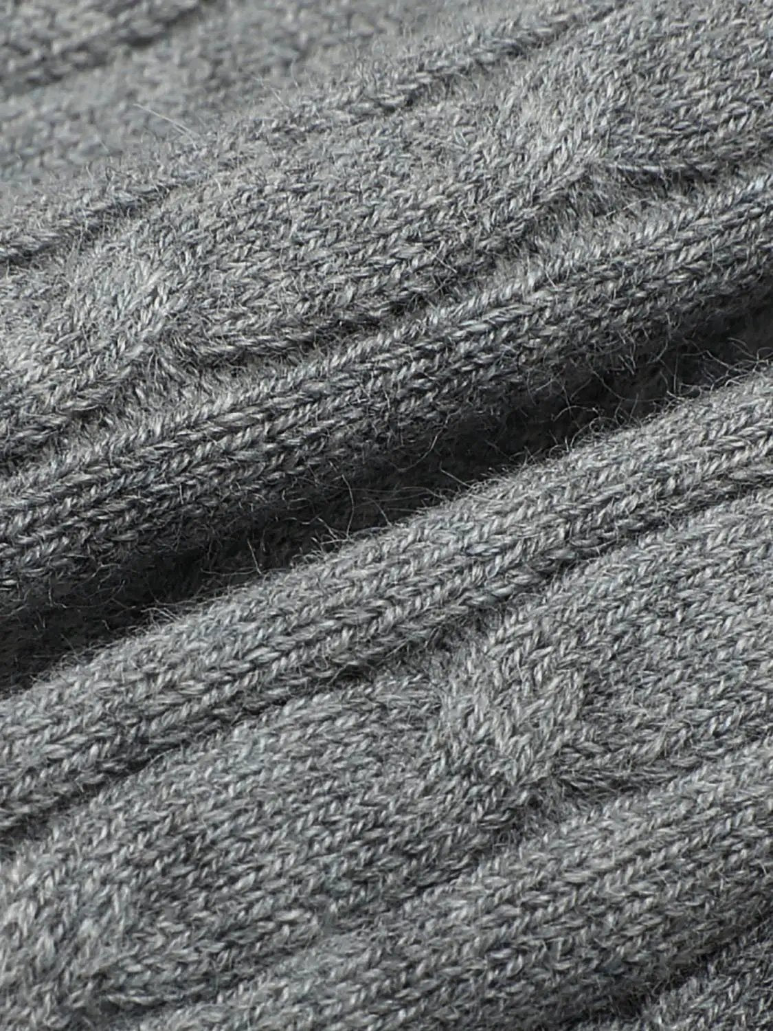 Knit jacket in heather gray knitted fabric with a textured weave.