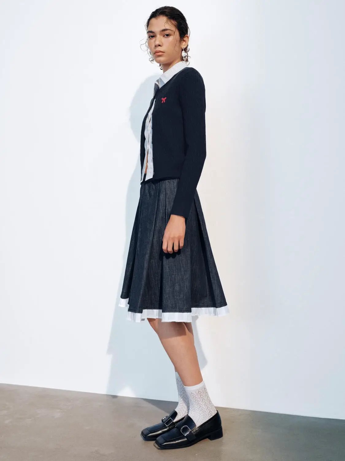 Knit Jacket by Urban Revivo Fashion, navy cardigan worn over a light striped shirt with a denim skirt.