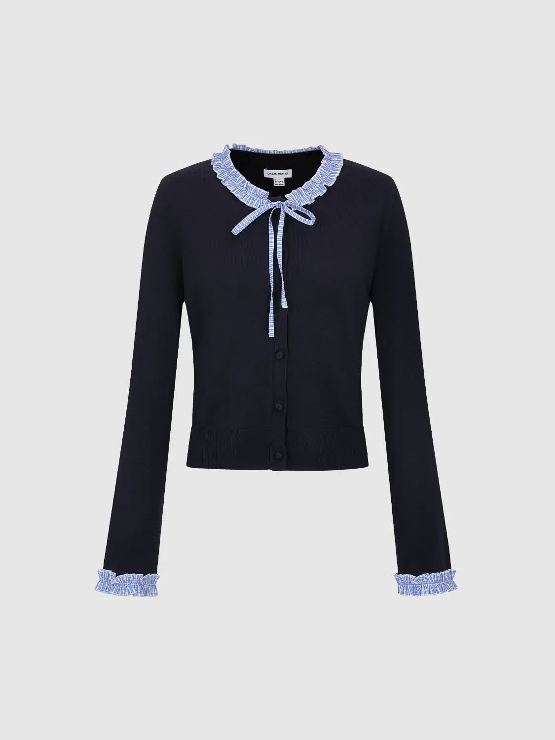 Knitted cardigan in navy with light-blue gingham ruffle collar, cuffs, and tie-front.