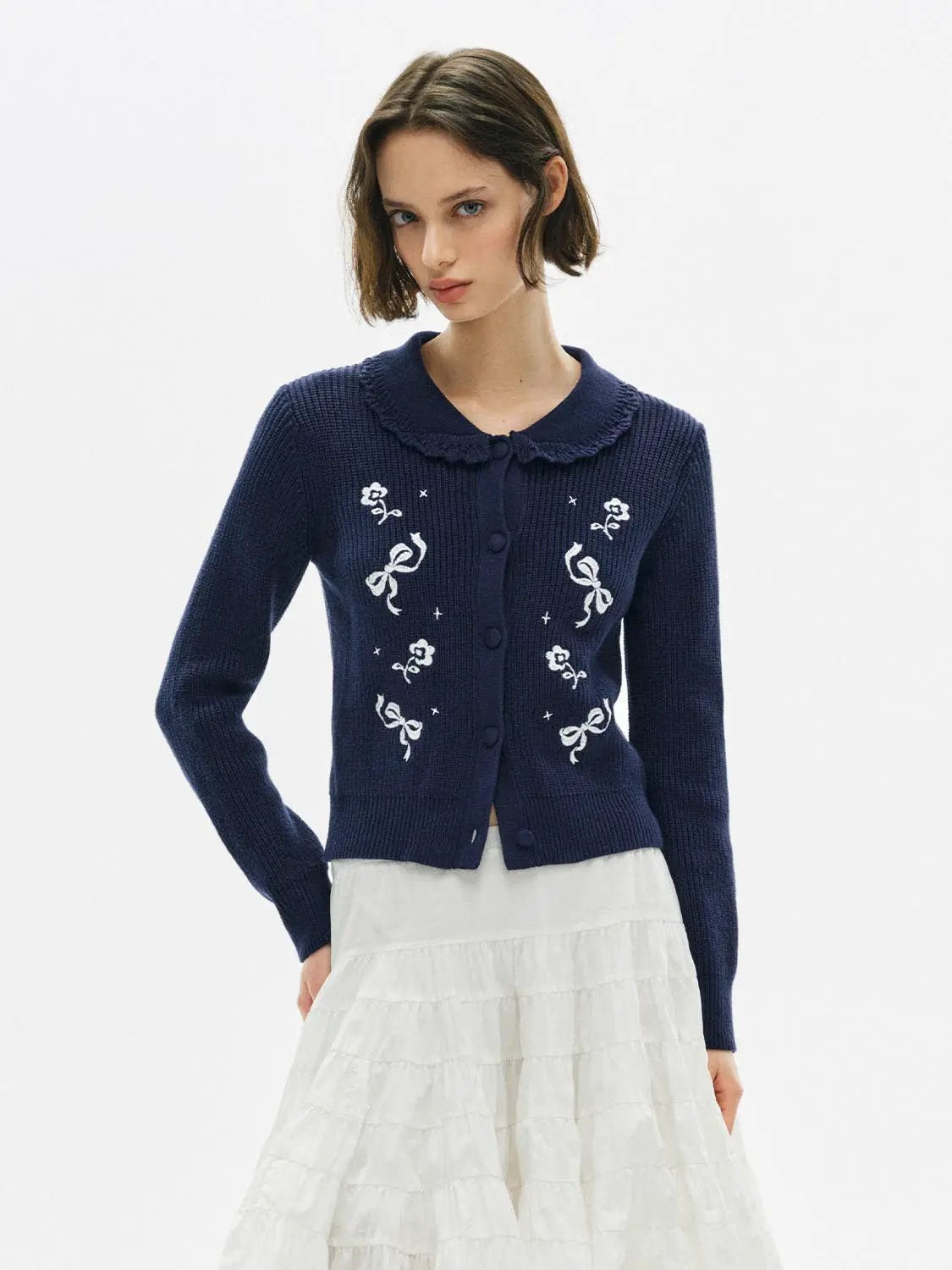 Knitwear jacket in navy with white embroidered florals and bow motifs; Urban Revivo Fashion