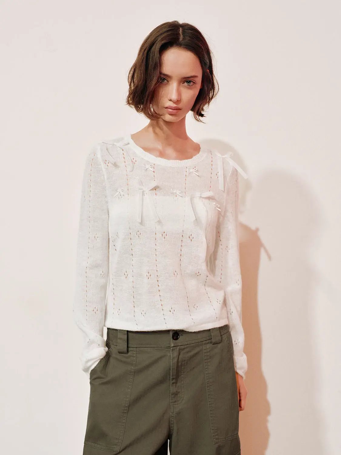 Bow-detail textured white crew-neck knit sweater, Urban Revivo.