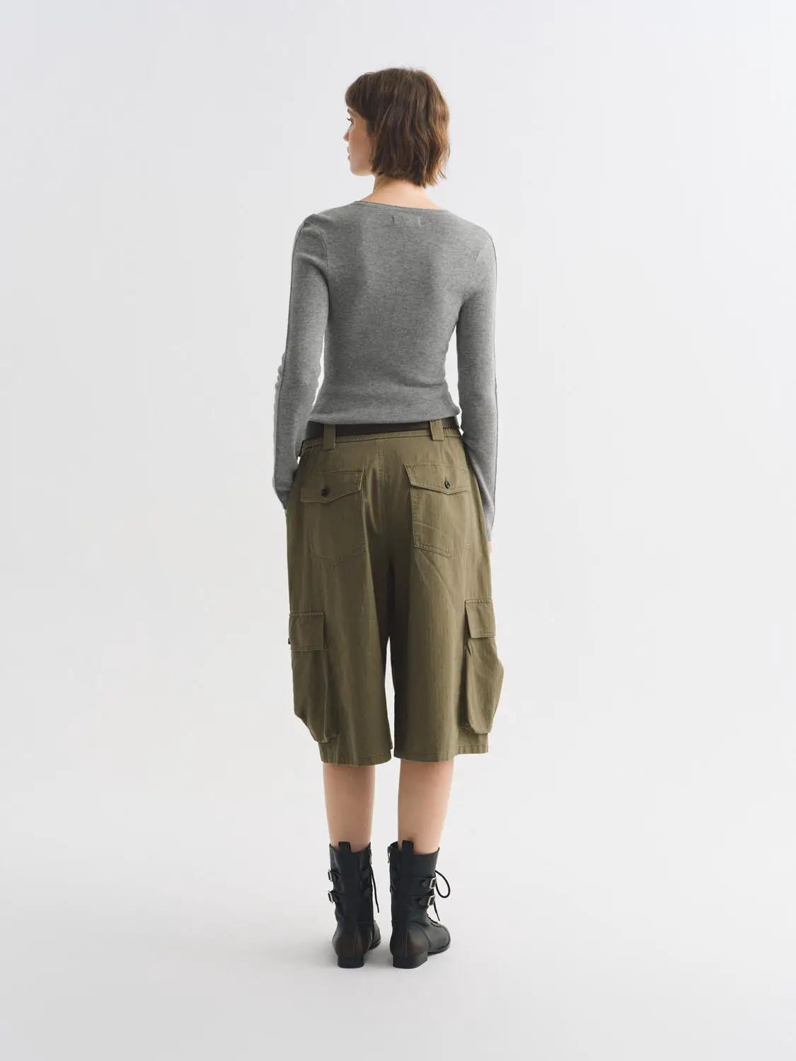 Knit T-Shirt worn by model in gray knit top, paired with olive cargo shorts, back view