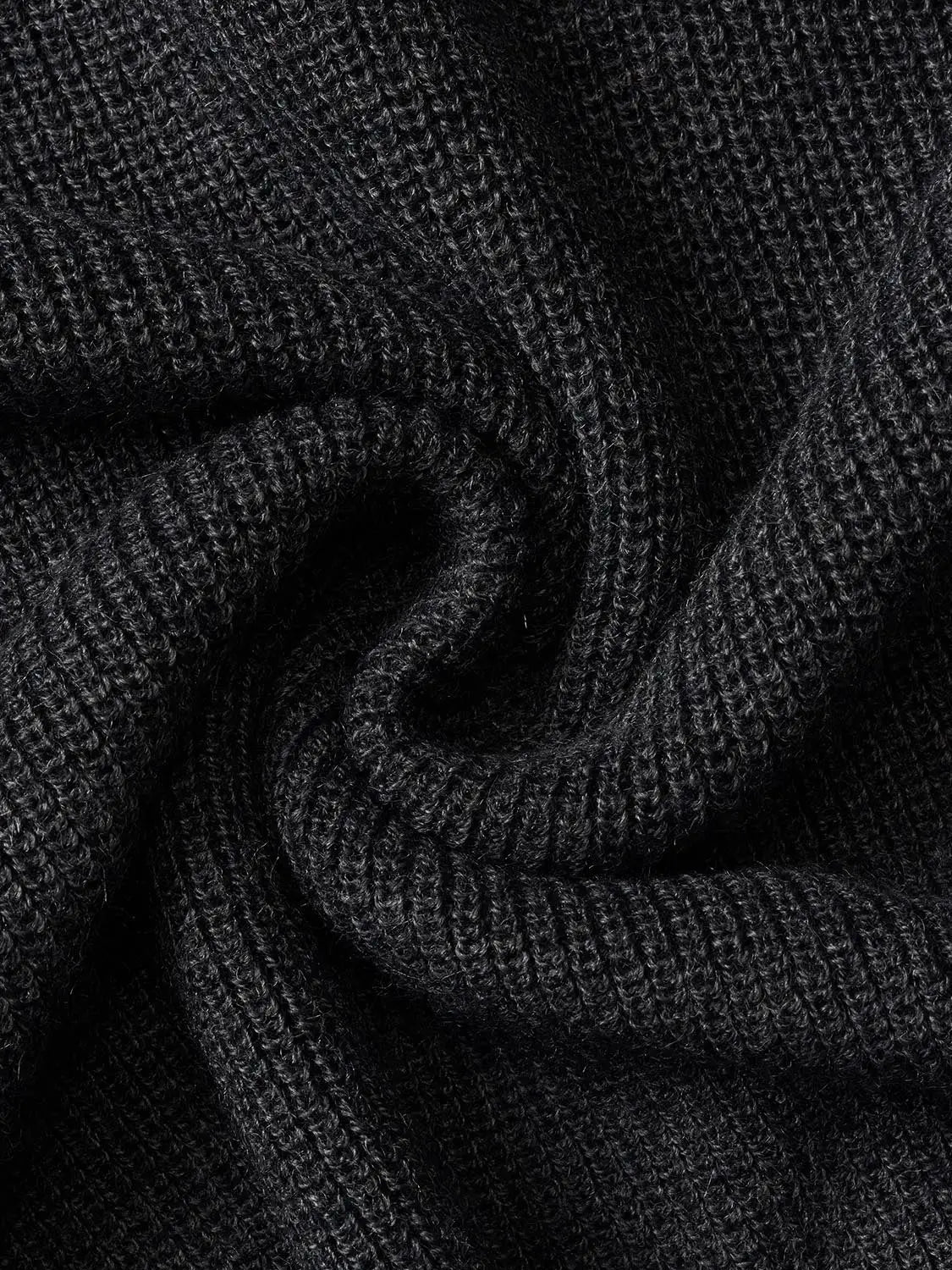 Knit T-Shirt in black ribbed knit fabric; close-up textured knit material.